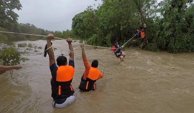 Swollen river caused by heavy rains from Tropical Storm in northern Philippines